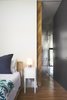 Full height closet storage cabinets and post oak pocket door. Photo 17 of Airole Way Residence modern home