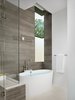 Master bathroom with marble tile and custom steel corner window. Photo 15 of Vance Lane Residence modern home