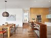 Dining and Kitchen with view towards Master Bedroom. Walnut slab bar with live edge. Photo 10 of Vance Lane Residence modern home