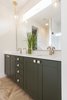 Modern home with Bath Room, Porcelain Tile Wall, Stone Counter, Porcelain Tile Floor, Subway Tile Wall, Undermount Sink, Two Piece Toilet, Pendant Lighting, Glass Tile Wall, and Enclosed Shower. Unit A - Master Bath - Here we used a green that we found from a shirt we had and had it color matched because, why not :) Photo 2 of The Reyes Duplex