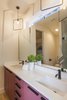 Modern home with Bath Room, Undermount Sink, Subway Tile Wall, Enclosed Shower, Pendant Lighting, Recessed Lighting, Porcelain Tile Floor, One Piece Toilet, Stone Counter, Glass Tile Wall, and Stone Tile Wall. Unit B - Master Bath - More color! This was actually based off a pink that one of our clients had on their nails. It had a matte color that inspired us to design the cabinets this way! Photo 8 of The Reyes Duplex