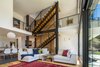 Modern home with Living Room, Coffee Tables, Ceiling Lighting, Recessed Lighting, Sectional, and Medium Hardwood Floor. Main House Living Room Photo 4 of The Tesla of Boulder Homes Offered at $3,950,000