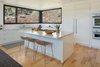 Modern home with Kitchen, Marble Counter, White Cabinet, Medium Hardwood Floor, Stone Slab Backsplashe, Ceiling Lighting, Undermount Sink, Refrigerator, Wall Oven, Cooktops, and Dishwasher. Main House Kitchen Photo 7 of The Tesla of Boulder Homes Offered at $3,950,000