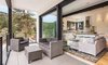 Modern home with Living Room, Sofa, Ceiling Lighting, Pendant Lighting, and Medium Hardwood Floor. Alternate Dwelling Unit Photo 13 of The Tesla of Boulder Homes Offered at $3,950,000