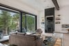 Modern home with Living Room, Coffee Tables, Sofa, Ceiling Lighting, Medium Hardwood Floor, and Gas Burning Fireplace. Alternate Dwelling Unit Living Room Photo 14 of The Tesla of Boulder Homes Offered at $3,950,000