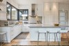 Modern home with Kitchen, White Cabinet, Ceiling Lighting, Medium Hardwood Floor, Quartzite Counter, Pendant Lighting, Refrigerator, and Undermount Sink. Alternate Dwelling Unit Kitchen Photo 15 of The Tesla of Boulder Homes Offered at $3,950,000
