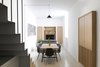 The cromatic palette is essential: black and deep grey for the staircase and some accessories; light oak wood for the furniture and flooring, and light grey for the resign flooring. Photo of EXISTENZ MINIMUM- Palermo House A223 modern home