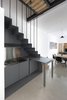 The kitchen cabinetry was designed to optimize the space. It can be opened and become a fully equipped cooktop and kitchen sink with a drop-leaf opening table. Photo 3 of EXISTENZ MINIMUM- Palermo House A223 modern home