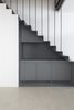 The steel staircase takes centre stage, conceived as a functional volume encasing an understair kitchen closet, whose main feature is its deep grey colour Photo 4 of EXISTENZ MINIMUM- Palermo House A223 modern home