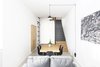 Modern home with Living Room, Chair, Sofa, Ceiling Lighting, Floor Lighting, Table Lighting, and Pendant Lighting. All furniture is made of oak wood except the staircase volume made entirely of black steel. Photo 6 of EXISTENZ MINIMUM- Palermo House A223