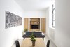 Modern home with Living Room, Sofa, and Pendant Lighting. The wall unit, the built in closet are conceived as functional elements and partialy built into walls to save space. Photo 9 of EXISTENZ MINIMUM- Palermo House A223
