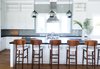 Modern home with Kitchen, Engineered Quartz Counter, White Cabinet, Medium Hardwood Floor, Cooktops, Recessed Lighting, Drop In Sink, Pendant Lighting, and Mosaic Tile Backsplashe. Kitchen Island Photo 7 of Bahamian Retreat