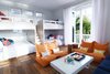 Modern home with Kids Room, Bedroom Room Type, Bed, Chair, Bunks, Storage, Night Stands, Medium Hardwood Floor, Teen Age, Neutral Gender, and Pre-Teen Age. Bunk Room Photo 7 of Bahamas Style