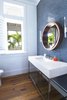 Modern home with Bath Room, Stone Counter, Medium Hardwood Floor, Undermount Sink, Wall Lighting, Mosaic Tile Wall, and One Piece Toilet. Guest Bathroom Photo 6 of Bahamas Style