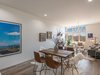 Modern home with Living Room, Medium Hardwood Floor, Chair, Pendant Lighting, Dark Hardwood Floor, Sofa, Ceiling Lighting, Coffee Tables, and Bench. The floors are barn wood and bring in warmth into the contemporary space. Photo 11 of One Of A Kind Santa Fe Modern Home