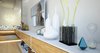 Previously existing walls were brought down, in order to create an open space, unifying a kitchen, a dining room and a living room. Merging aesthetic continues on to the bedroom, where two sinks and the wardrobe become the part of the room, as opposed to traditional approach of keeping them locked away from eye.
The apartment overlooks the city and the mountains, and for the outer visual richness to be fully embraced, the windows were enlarged to the wall scale.
Photo 14 of Double N Residence modern home
