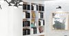 Previously existing walls were brought down, in order to create an open space, unifying a kitchen, a dining room and a living room. Merging aesthetic continues on to the bedroom, where two sinks and the wardrobe become the part of the room, as opposed to traditional approach of keeping them locked away from eye.
The apartment overlooks the city and the mountains, and for the outer visual richness to be fully embraced, the windows were enlarged to the wall scale.
Photo 7 of Double N Residence modern home