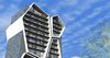 The framework of the apartment building is intercepted by the large, polygon shaped forms. Each one of these massive structures is irregularly angled in relation to the basic structure, giving the exterior more volume and a sense of movement.
The first 4 floors are elongated in the back and are assigned to the garage. This was the fundamental idea, upon which the rest of the space was built.
Photo 3 of R01 Hyper modern home