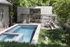 Modern home with Outdoor, Grass, Concrete Pools, Tubs, Shower, Wood Patio, Porch, Deck, and Walkways. A grassy area provides a spot for sunning poolside, and a steel trellis shades an integrated dining area beyond Photo 4 of Garner Pool & Casita