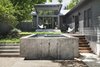 Modern home with Outdoor, Concrete Pools, Tubs, Shower, Concrete Patio, Porch, Deck, Wood Patio, Porch, Deck, Hardscapes, and Walkways. View looking from the new deck along the central axis towards the new pool and existing living room (with new concrete deck). The new design built-up the sloping site around the pool so its surface could be raised to allow more of a connection between the existing indoor spaces and the water. Photo 2 of Garner Pool & Casita