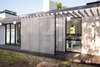 Modern home with Exterior, House Building Type, and Metal Roof Material. back yard w/ outdoor shower Photo 3 of Glendessary Lane