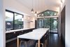 Modern home with Kitchen, Refrigerator, Wall Oven, Cooktops, Range Hood, Dishwasher, Engineered Quartz Counter, Pendant Lighting, Wood Cabinet, Ceiling Lighting, Undermount Sink, and Wall Lighting. kitchen w/ island dining Photo 5 of Glendessary Lane