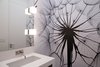 Modern home with Bath Room, Engineered Quartz Counter, Porcelain Tile Floor, Undermount Sink, Ceiling Lighting, Wall Lighting, Recessed Lighting, Porcelain Tile Wall, and One Piece Toilet. powder room w/ custom wall graphic Photo 9 of Glendessary Lane