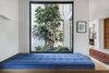 Modern home with Windows, Metal, and Picture Window Type. Ravit Dvir Architecture and Design installed windows and kept furnishings scarce to open up The House in Harutzim. This cobalt blue bench offers a sweeping view of the inner courtyard. Photo 6 of The House in Harutzim