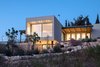 Modern home with Outdoor, Back Yard, Vegetables, Large Patio, Porch, Deck, Slope, Side Yard, Trees, Gardens, Pavers Patio, Porch, Deck, Concrete Patio, Porch, Deck, Garden, Metal Fences, Wall, Wood Patio, Porch, Deck, Metal Patio, Porch, Deck, Wood Fences, Wall, Decking Patio, Porch, Deck, Stone Fences, Wall, Landscape Lighting, Stone Patio, Porch, Deck, and Concrete Fences, Wall. Ravit Dvir Architecture and Design Photo 2 of The house in Mei Ami