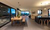 Modern home with Dining Room, Chair, Table, Ceramic Tile Floor, Lamps, Ceiling Lighting, Bench, Wood Burning Fireplace, and Standard Layout Fireplace. Ravit Dvir Architecture and Design Photo 4 of The house in Mei Ami