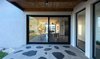 Modern home with Outdoor, Grass, Stone Fences, Wall, Metal Fences, Wall, Wire Fences, Wall, Hanging Lighting, Concrete Fences, Wall, and Back Yard. Ravit Dvir Architecture and Design Photo 5 of The house in Mei Ami