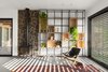 Modern home with Living Room, Bookcase, Ceiling Lighting, Wood Burning Fireplace, Chair, Ceramic Tile Floor, and Sofa. Ravit Dvir Architecture and Design Photo 8 of The house in Mei Ami