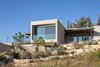 Modern home with Outdoor, Trees, Garden, Slope, Gardens, Back Yard, Wire Fences, Wall, Concrete Patio, Porch, Deck, Vegetables, Metal Patio, Porch, Deck, Wood Patio, Porch, Deck, Concrete Fences, Wall, Stone Fences, Wall, Wood Fences, Wall, and Grass. Ravit Dvir Architecture and Design Photo 17 of The house in Mei Ami