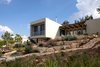 Modern home with Outdoor, Vegetables, Concrete Patio, Porch, Deck, Trees, Gardens, Back Yard, Stone Fences, Wall, Metal Patio, Porch, Deck, Grass, and Concrete Fences, Wall. Ravit Dvir Architecture and Design Photo 18 of The house in Mei Ami
