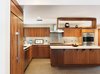 Modern home with Sliding Window Type, Metal, Cable Railing, Porcelain Tile Floor, Wood Railing, Wood Tread, Accent Lighting, Picture Window Type, Ceiling Lighting, Table, Recessed Lighting, Engineered Quartz Counter, Glass Tile Backsplashe, Refrigerator, Wood Cabinet, Wall Oven, Cooktops, Range Hood, Dishwasher, and Kitchen. Kitchen Photo 9 of Alpine Street
