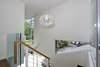 Modern home with Wood Railing, Wood Tread, Metal Railing, Glass Railing, Cable Railing, Windows, Picture Window Type, Casement Window Type, and Metal. 2nd floor stair landing Photo 12 of Alpine Street