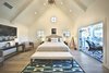 The second master bedroom with vintage French country bed for the ultimate romantic weekend. Photo of Streamlined Cape Cod at The Wedge modern home