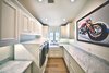 Laundry room with extra counter space and storage to service needs of large family spending time at the beach. Photo 6 of Streamlined Cape Cod at The Wedge modern home