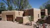 Modern home with Exterior, House, Stucco Siding Material, Wood Siding Material, and Stone Siding Material. Exterior View from Driveway Photo 3 of Santa Fe East Side Home