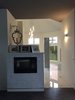 A fireplace with Miamond Marma mirror tile which leads into a 18ft octagon shape ensuite. Photo of The Swanson/Marconi House modern home