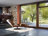 Modern home with Large Patio, Porch, Deck, Stone Patio, Porch, Deck, Pavers Patio, Porch, Deck, Picture Window Type, Recliner, Stone Tread, Chair, and Living Room. In contrast to the closed and compartmentalized layout of the original house, the addition provides ample opportunity for the family to connect with the outdoors. Photo 9 of Modern Farmhouse Addition