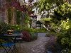 Modern home with Outdoor, Back Yard, Hardscapes, Trees, Flowers, Gardens, Shrubs, Walkways, Pavers Patio, Porch, Deck, and Large Patio, Porch, Deck. A wedge-shaped garden, enclosed within walls of an old industrial building, became the defining feature of the site. Photo of Urban Garden House
