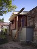 Modern home with Trees, Back Yard, Shrubs, Flowers, Hardscapes, Gardens, Walkways, Large Patio, Porch, Deck, Storage Space Room Type, Playroom Room Type, Detached Garage Room Type, and Kids Room. A garden storage shed with a children's playhouse above was built towards the rear of the garden. Photo 8 of Urban Garden House