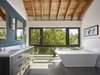 Modern home with Wall Lighting and Undermount Sink. Master bed and bath spaces orient towards the south-facing window wall, and receive plentiful natural light throughout the day. Photo 17 of Wallingford Passive Solar House