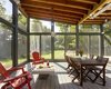 A generous screened porch and open patios extend living spaces to the outdoors. Photo 12 of Wallingford Passive Solar House modern home