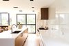 Taking influences from mid-century modern and Scandinavian design, warmth is achieved in the clean, simple space through the utilization of wood as the primary material. Photo 2 of Ravine House modern home