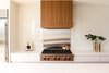 The Sub-Zero and Wolf appliances, which include a fridge, cook top, and a wall oven, were selected for both their performance capabilities, as well as their aesthetic appeal, which suited the contemporary design of the kitchen. Photo 4 of Ravine House modern home