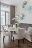 Modern home with Dining Room, Table, Chair, Shelves, Medium Hardwood Floor, and Bench. Dining Room Photo of Battery Park City Residence