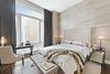 Modern home with Bedroom, Bed, Night Stands, Bench, Chair, Table Lighting, and Medium Hardwood Floor. Master Bedroom Photo 8 of Battery Park City Residence