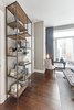 Modern home with Bedroom, Shelves, Table Lighting, and Medium Hardwood Floor. Master Bedroom Photo 10 of Battery Park City Residence